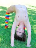 Flexible shaved pussy brunette Mila FTV does stretching exercises naked outdoors