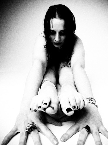 Here are black and white pics of nude flexible fetish model Claire Adams with jet black hair