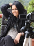Behind-the-scene shooting with brunette babe Madison Parker posing in a black suit
