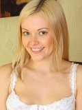 Angelic fair-haired lass Logan Bella in white lingerie spreads her legs and shows her pink slit