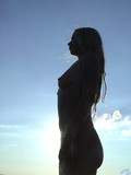 Young fair haired lass Ljuba Nubiles dressed in panties poses on peopleless beach