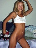 Well tanned amateur model Monique Alexander in white sneakers and top shows her bald snatch