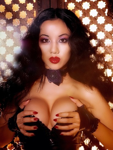 Glam asian Jade Vixen takes off her short tight latex dress and spreads her ultra long legs