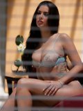 Busty 30 year old beauty Natalia Cruze strips out of her revealing underwear
