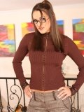 Brown haired babe Misty Anderson in glasses gets totally nude and displays her shaved beaver