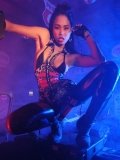 Asian fetish babe Asia McKenZie in black boots poses with shotgun in hand