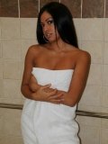 Tight bodied tan skinned latina Cassandra Cruz showers her smoothly shaved pussy