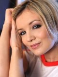 Really sensuous close-ups of cute blonde babe Faye X cuddling in the armchair