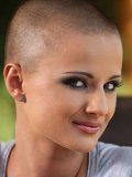 Charming short haired porn model Sinead in mini skirt and sneaks makes her eyes on you