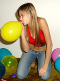 With her long blonde hair Katrina Nubiles blows up balloons and shows her teen side with cuteness. 