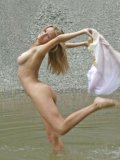 Playful white haired girl Julia Am with adorable shapely boobs loves to swim in the nude