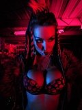 Big racked fetish lady Kobe Kaige with crazy make-up does some modeling in the dark